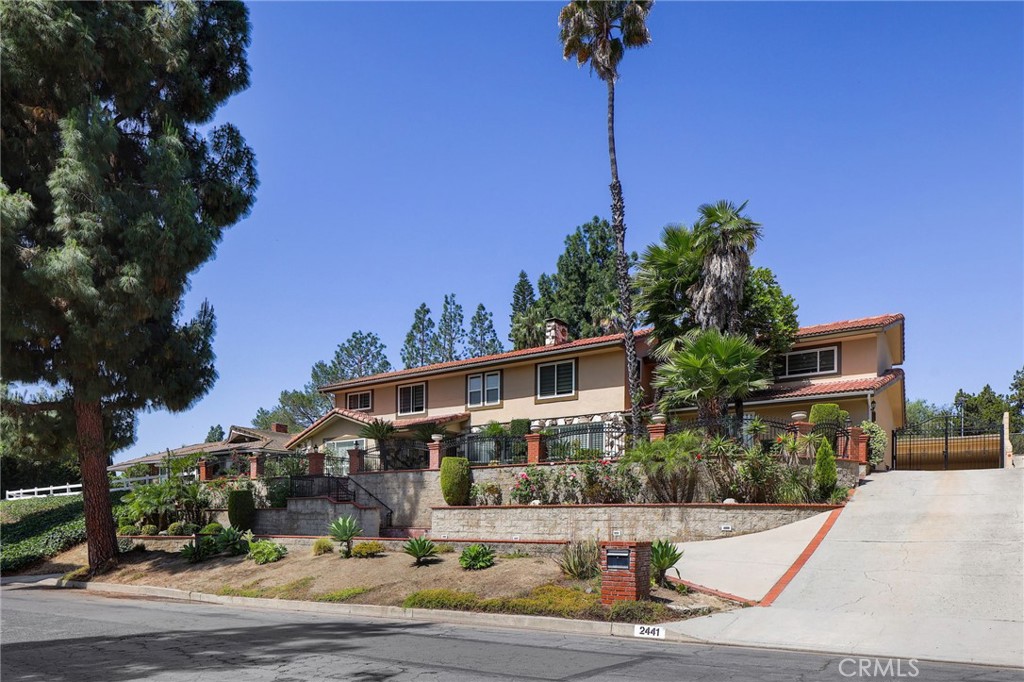 2441 Terraza Place Fullerton, CA 92835 - Photo 3 of 61 a view of a house with a yard and potted plants