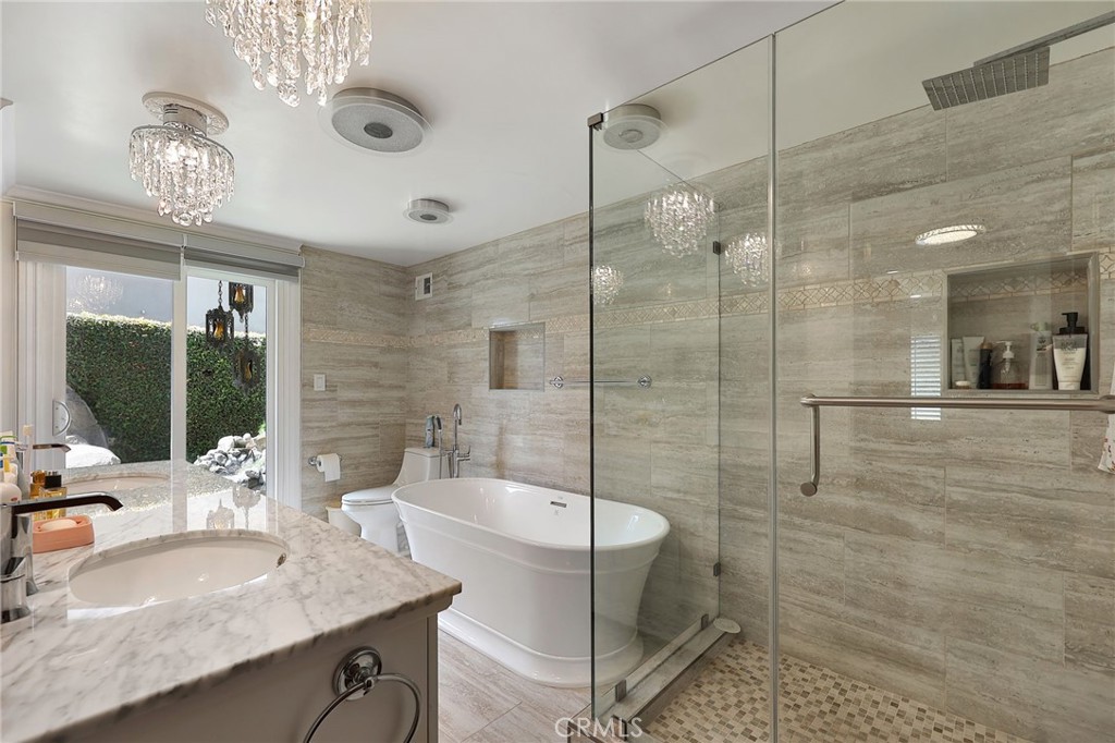 2441 Terraza Place Fullerton, CA 92835 - Photo 33 of 61 a bathroom with a granite countertop sink a mirror and shower