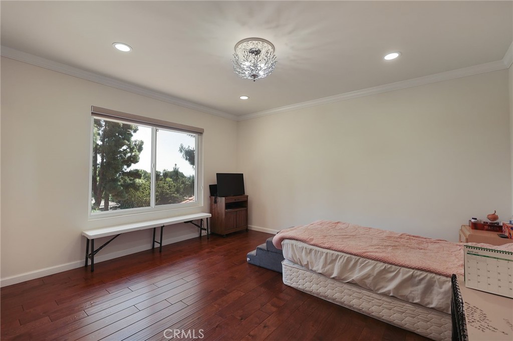 2441 Terraza Place Fullerton, CA 92835 - Photo 42 of 61 a spacious bedroom with a bed and a large window