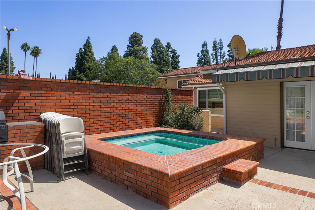 2441 Terraza Place Fullerton, CA 92835 - Photo 52 of 61 a backyard of a house with table and chairs