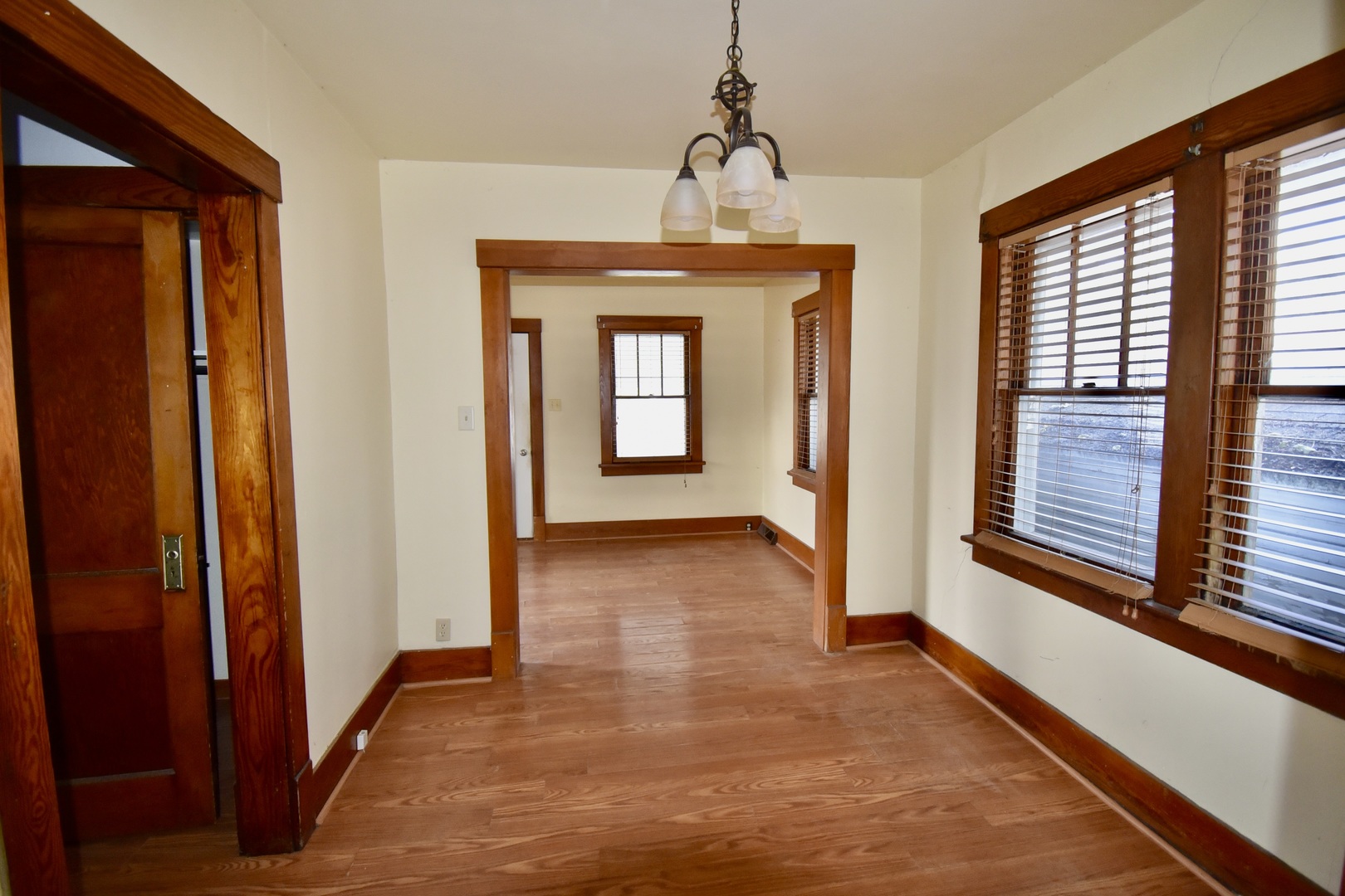 116 North Maple Street Clinton, IL 61727 - Photo 11 of 14 a view of a hallway with wooden floor and stairs