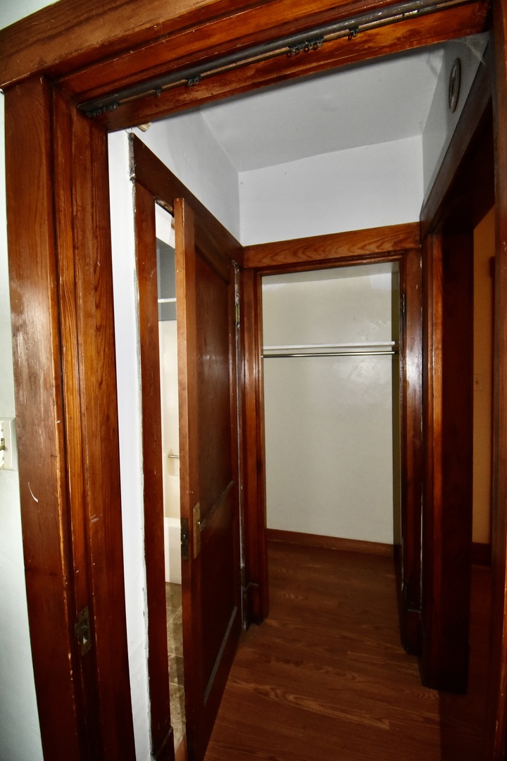 116 North Maple Street Clinton, IL 61727 - Photo 12 of 14 a view of a hallway with wooden floor