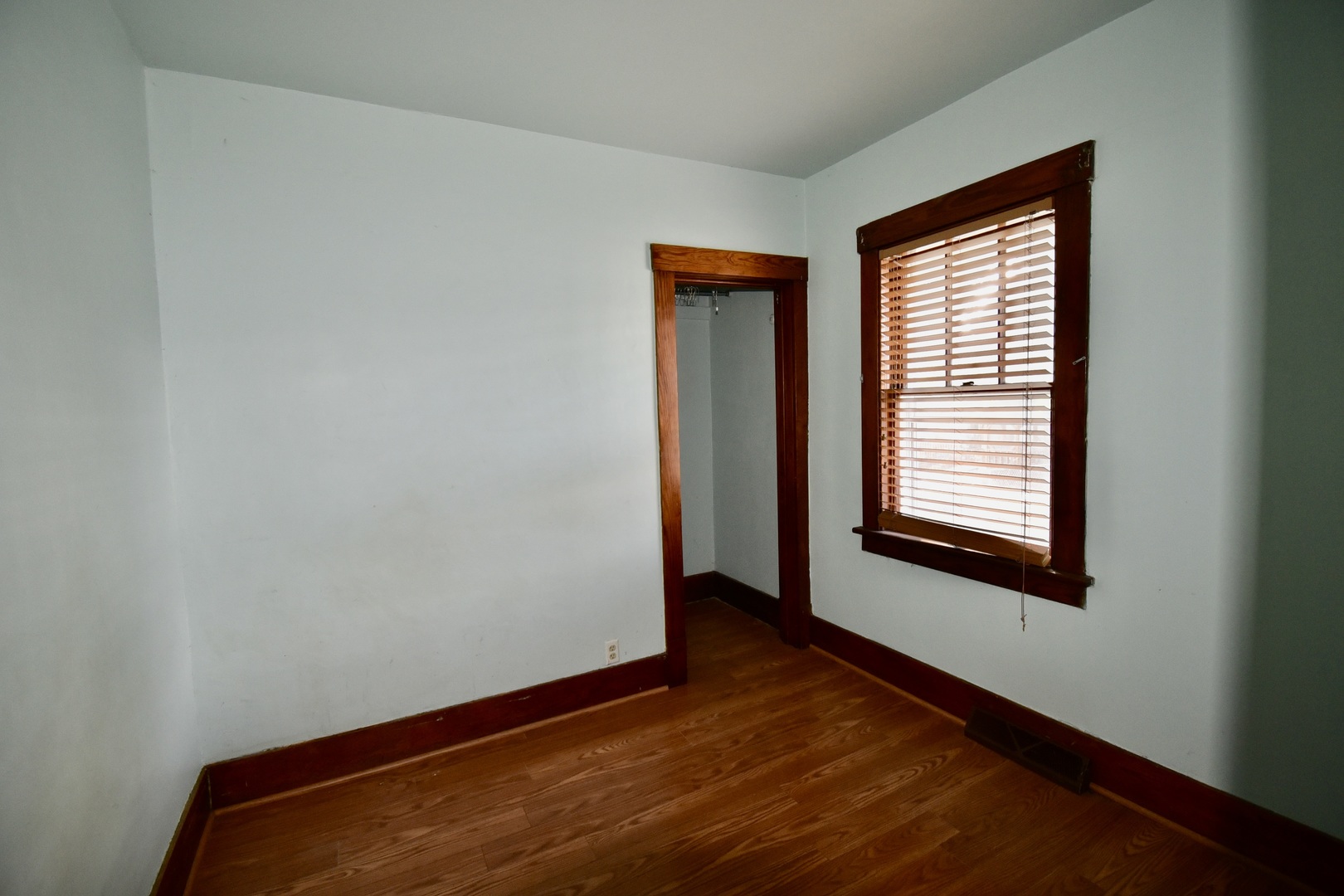 116 North Maple Street Clinton, IL 61727 - Photo 13 of 14 a view of an empty room with wooden floor and a window