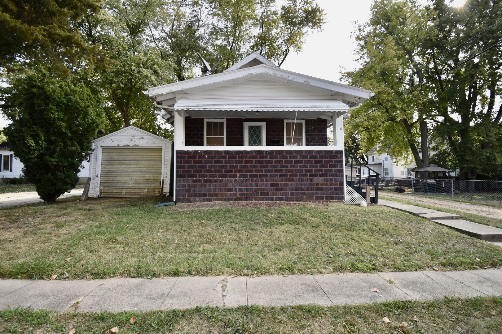 116 North Maple Street Clinton, IL 61727 - Photo 14 of 14 a front view of a house with a yard