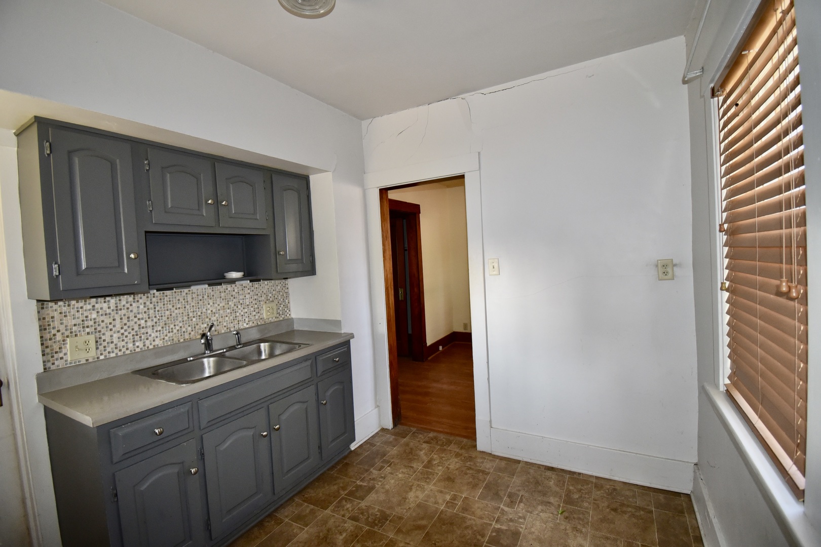 116 North Maple Street Clinton, IL 61727 - Photo 9 of 14 a kitchen with a sink and cabinets