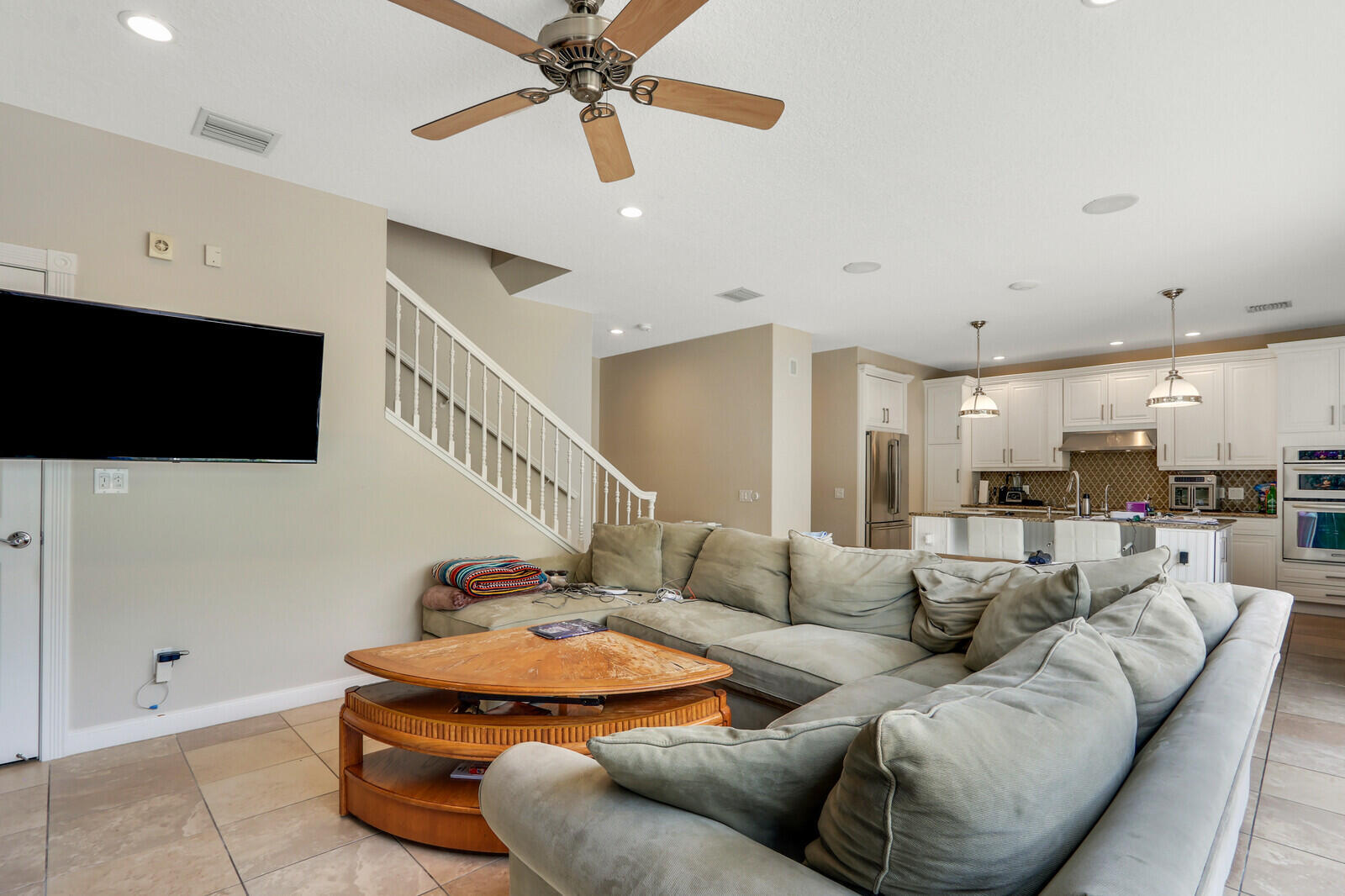 101 St Pierre Way Jupiter, FL 33458 - Photo 15 of 57 a living room with furniture and a flat screen tv