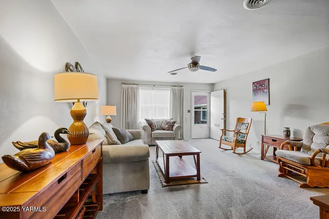 a bedroom with furniture and a lamp