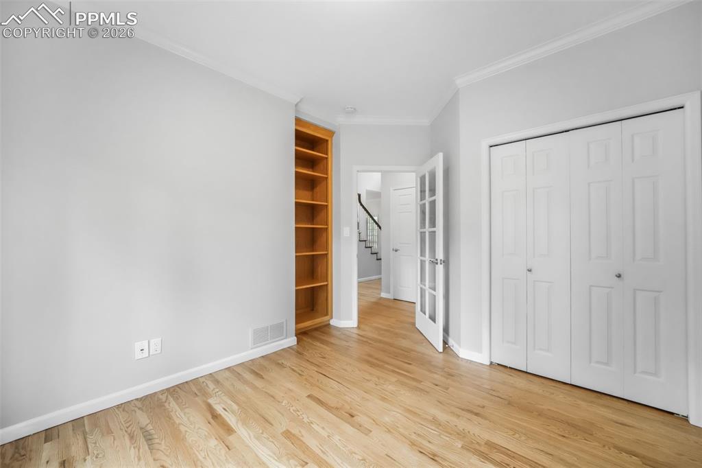 19010 Deerfield Road Monument, CO 80132 - Photo 21 of 50 a view of empty room with wooden floor and window