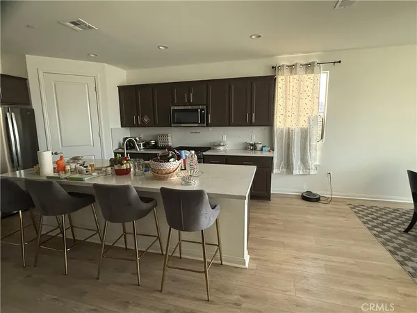 a kitchen with a sink cabinets and window