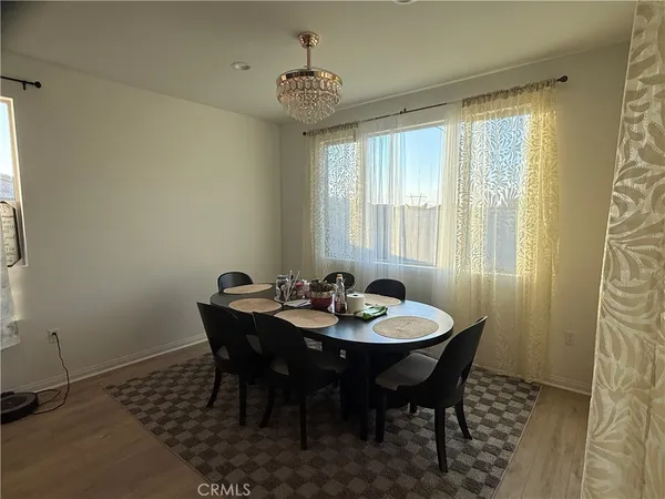 a view of a dining room with furniture and window