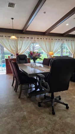 a bedroom with bed and a chandelier