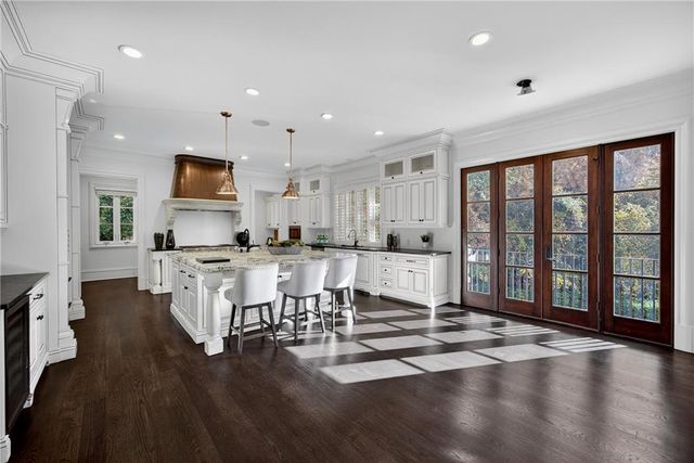 a living room with furniture potted plant and a fireplace