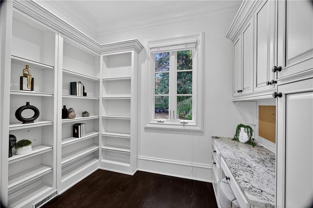 a view of a patio with table and chairs and potted plants