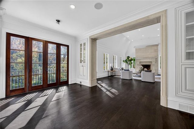 a spacious bedroom with a bed and a fireplace