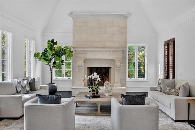 a bedroom with a large bed and a flat screen tv