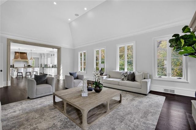 a spacious bathroom with a toilet a sink and bathtub