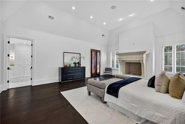 a bathroom with a granite countertop sink mirror bathtub and shower