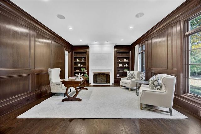 a kitchen with kitchen island a stove and a sink