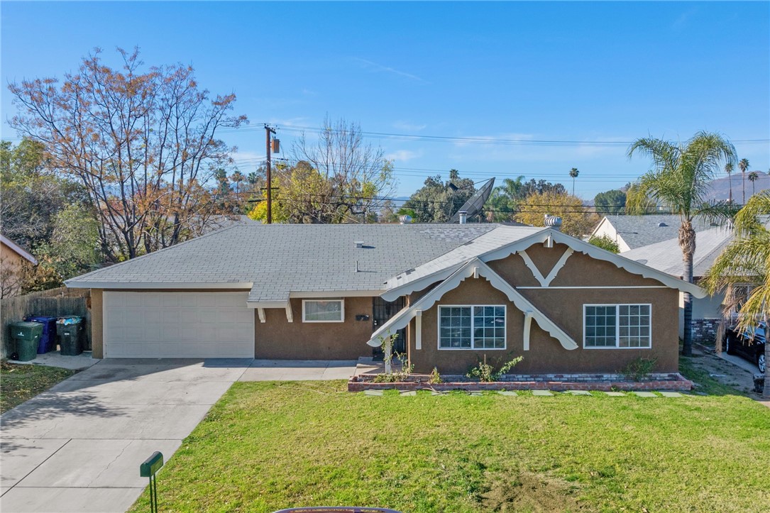 4196 Polk Street Riverside, CA 92505 - Photo 1 of 1 a front view of a house with a yard