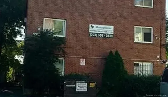 a front view of a house with yard