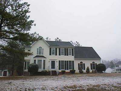 5500 Gatebridge Road Richmond, VA 23234 - Photo 1 of 1 a view of a white house next to a yard with large trees