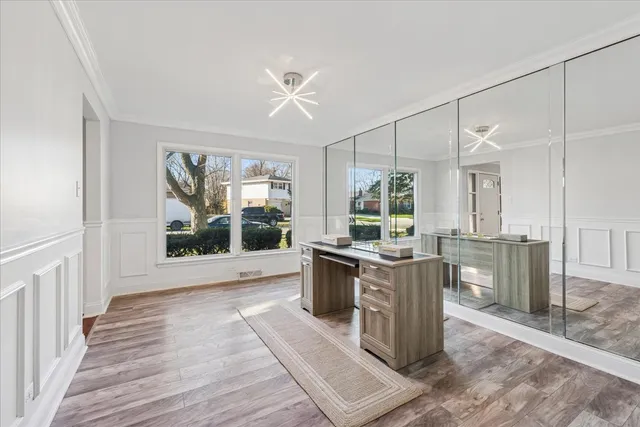 a kitchen with a stove a sink and wooden cabinets