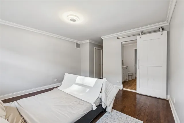 a bedroom with a bed and a table