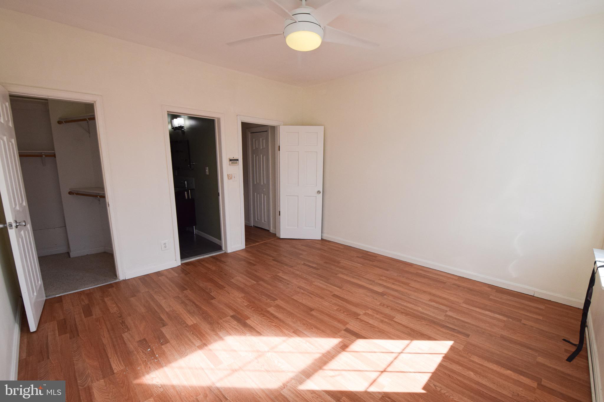 3606 Hudson Street Baltimore, MD 21224 - Photo 20 of 52 a view of a livingroom with wooden floor and cabinet