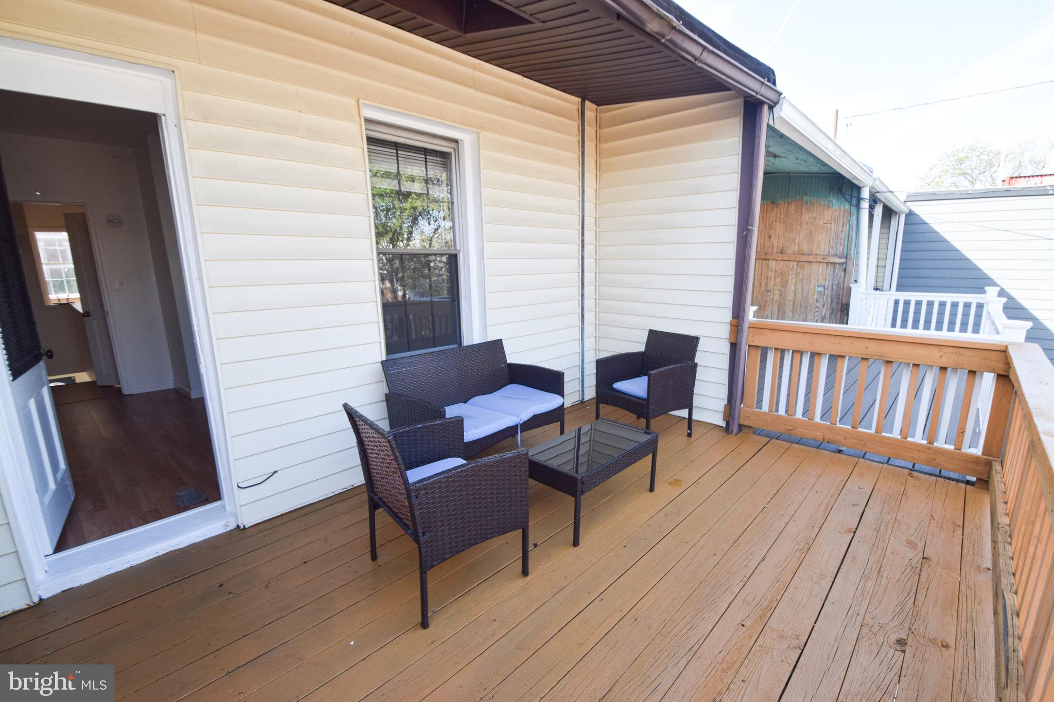 3606 Hudson Street Baltimore, MD 21224 - Photo 30 of 52 a view of a wooden chairs on the deck