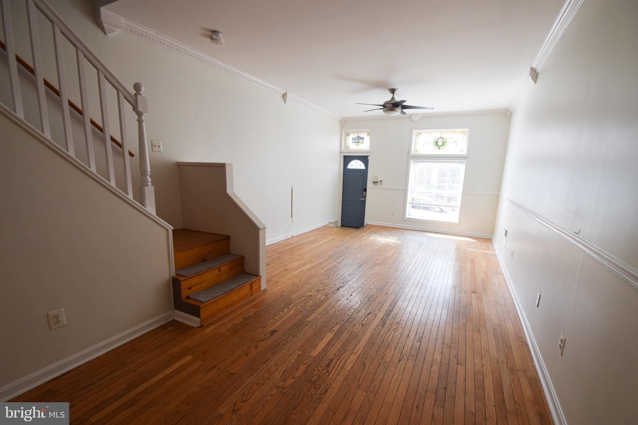 3606 Hudson Street Baltimore, MD 21224 - Photo 3 of 52 wooden floor in an empty room with a window