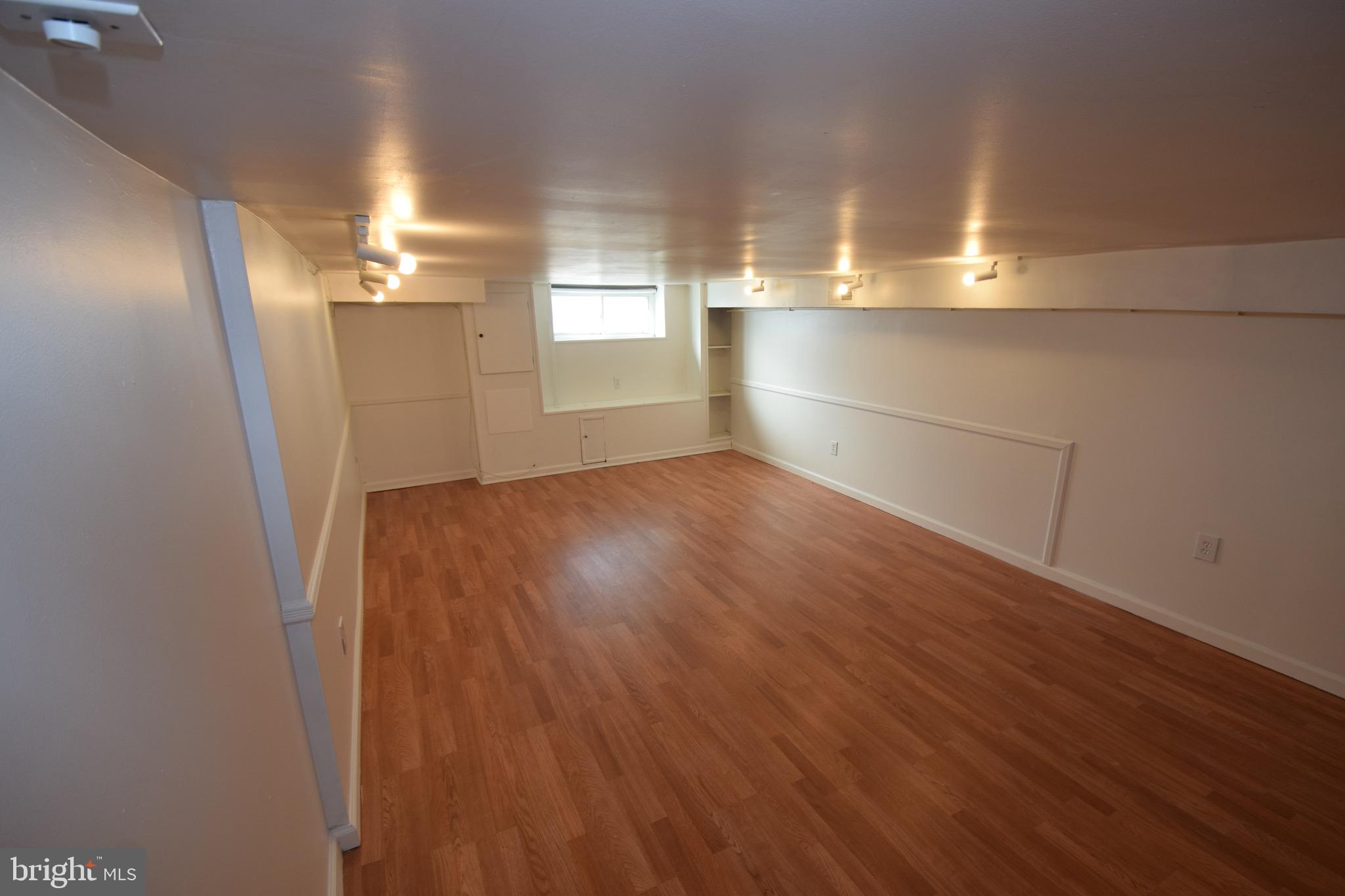 3606 Hudson Street Baltimore, MD 21224 - Photo 34 of 52 a view of a room with wooden floor and window