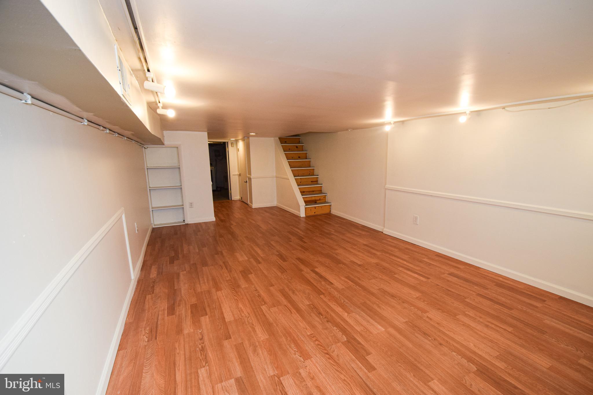 3606 Hudson Street Baltimore, MD 21224 - Photo 35 of 52 a view of empty room with wooden floor