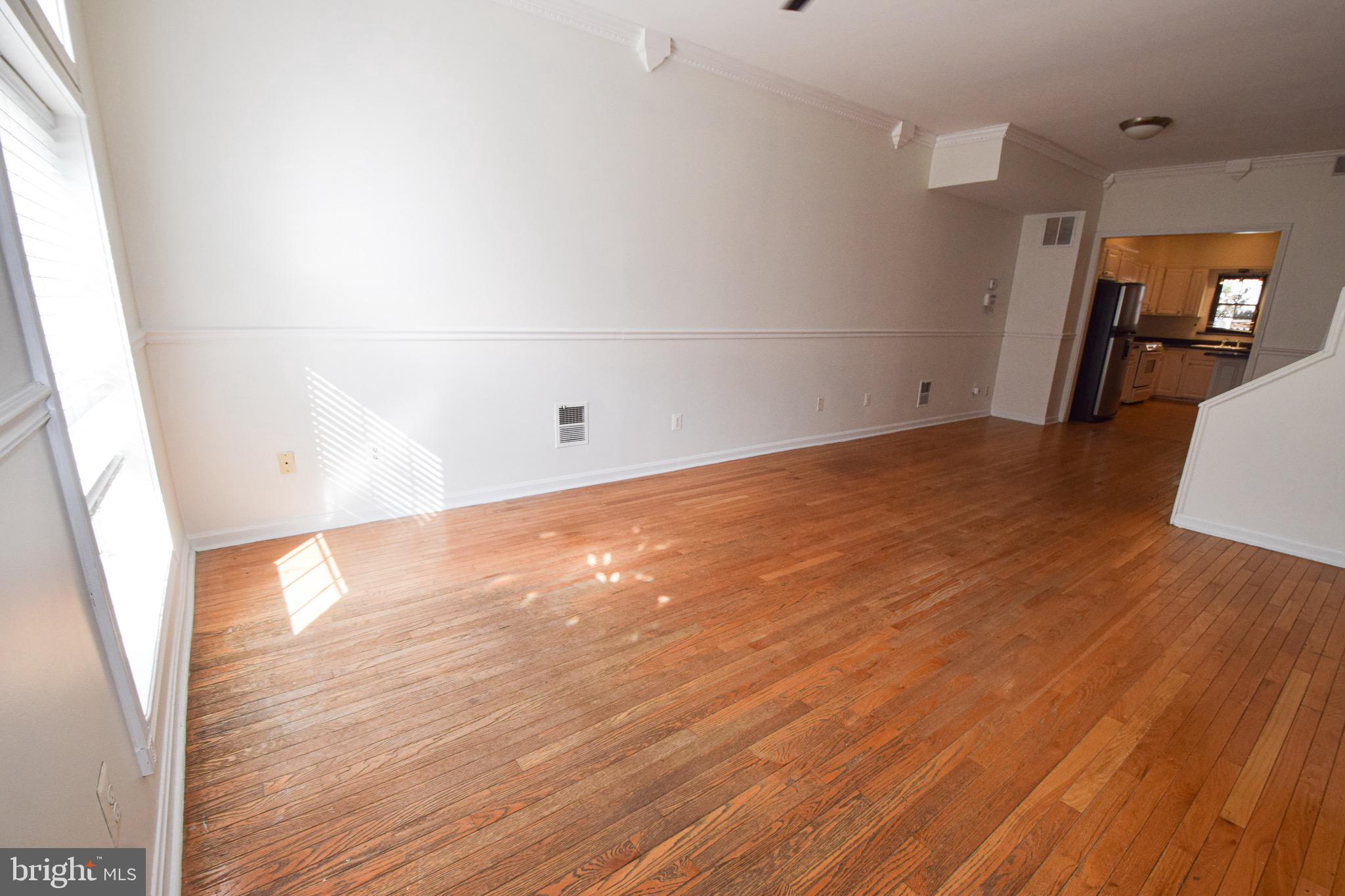 3606 Hudson Street Baltimore, MD 21224 - Photo 4 of 52 a view of a room with wooden floor