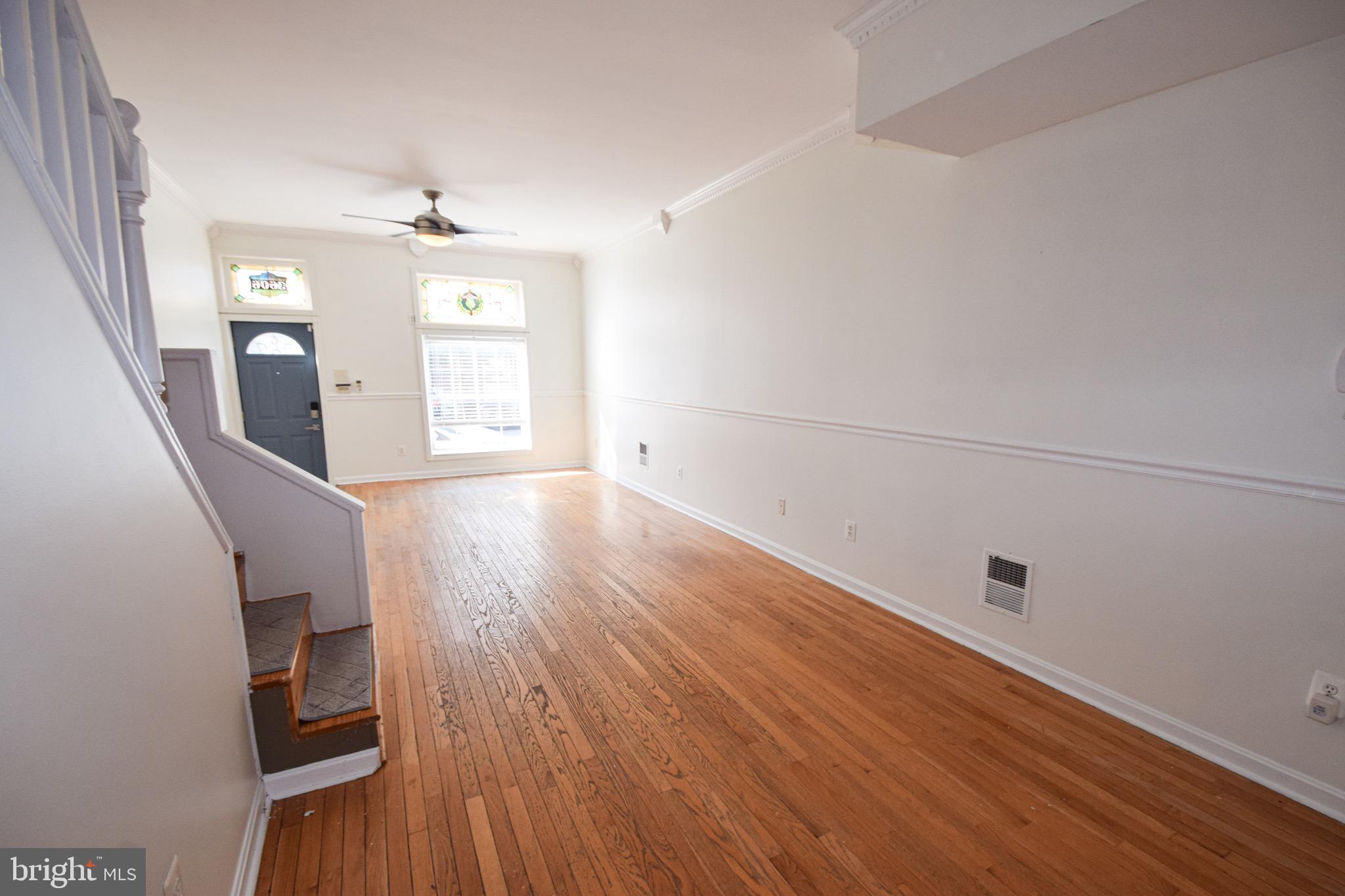 3606 Hudson Street Baltimore, MD 21224 - Photo 8 of 52 wooden floor in an empty room with a window