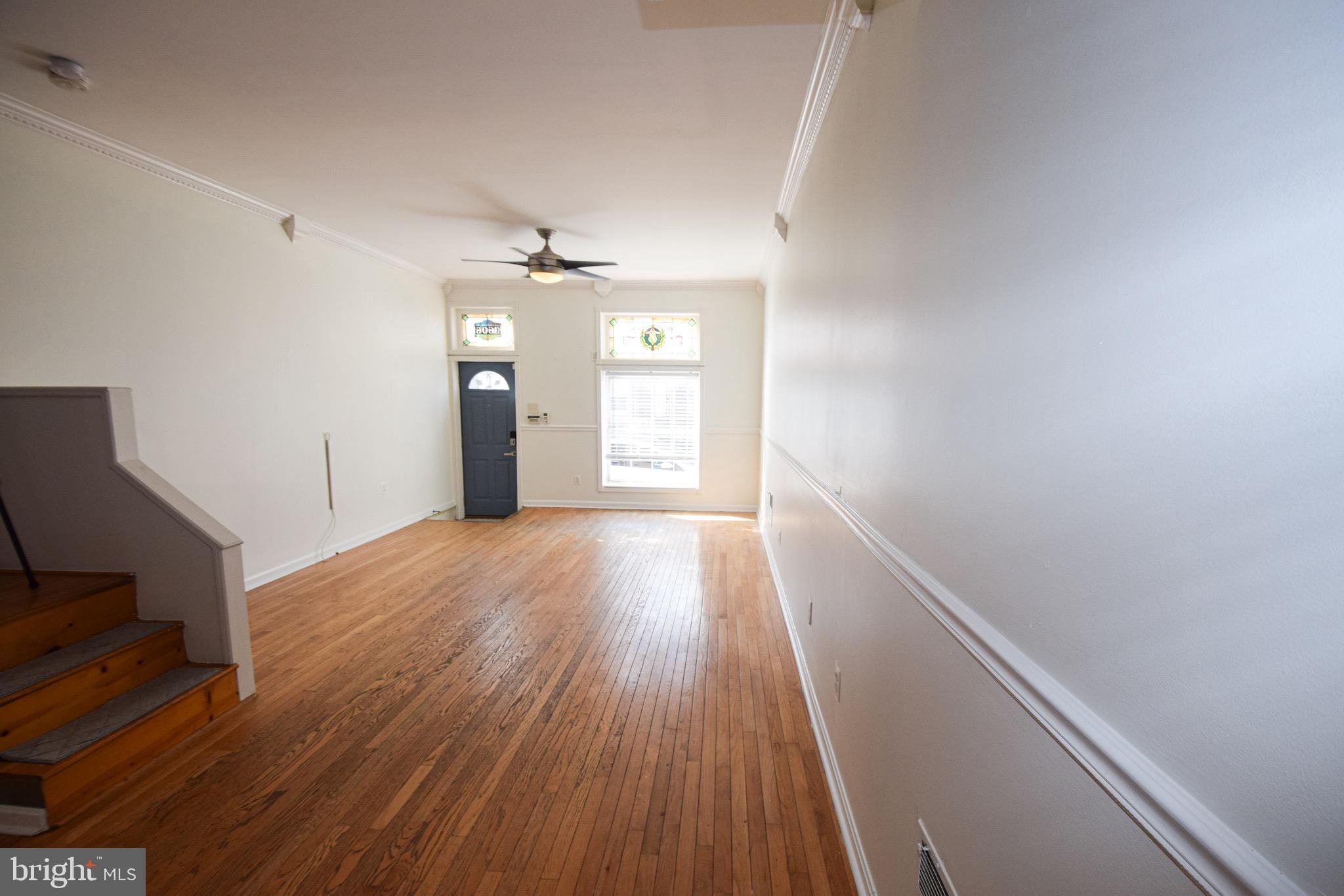 3606 Hudson Street Baltimore, MD 21224 - Photo 9 of 52 wooden floor in an empty room with a window