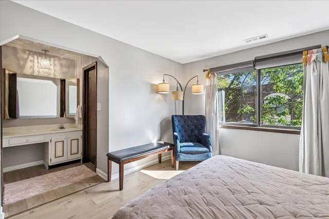 a bedroom with furniture and a window