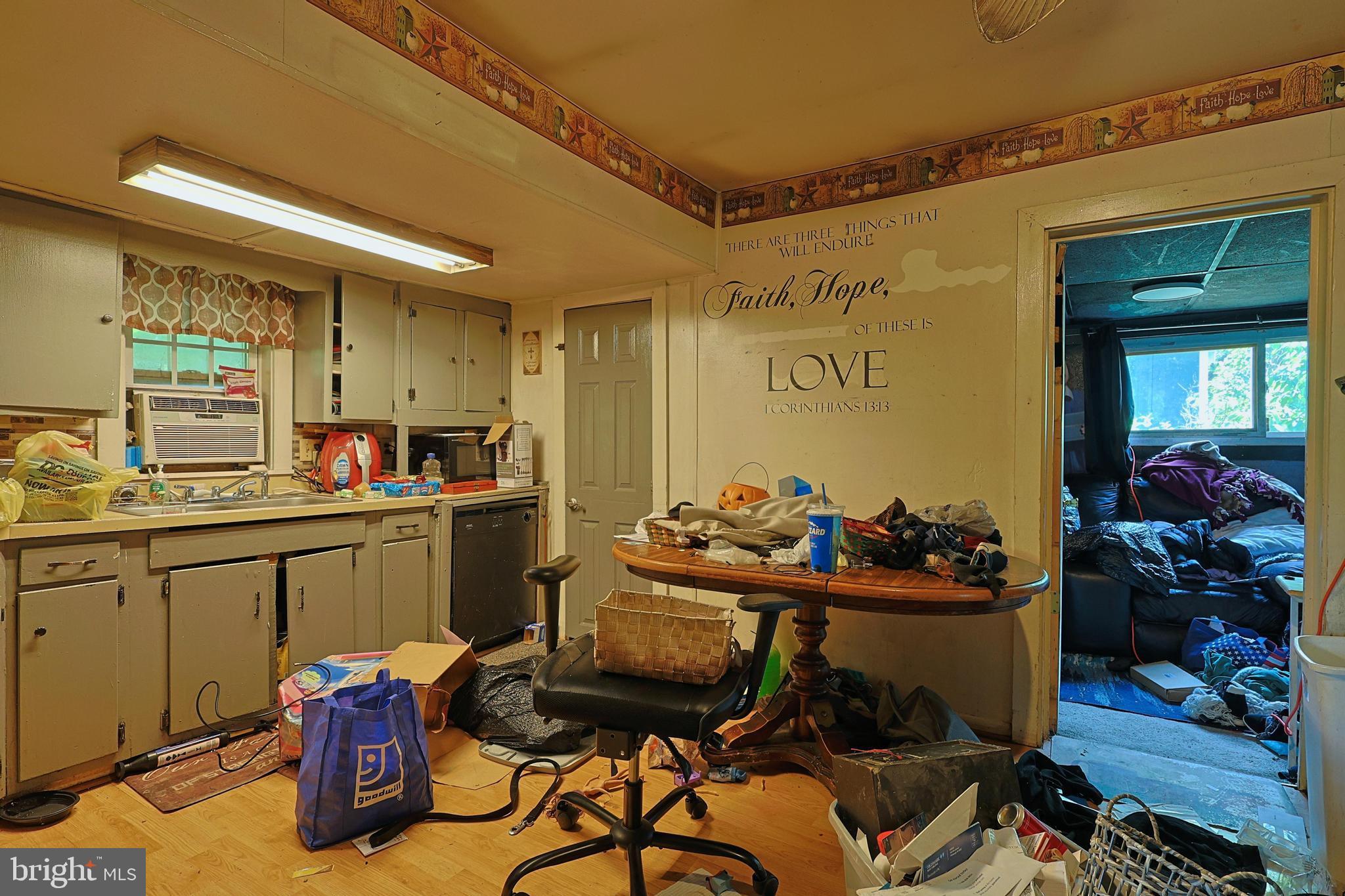 6307 Pious Ridge Road Berkeley Springs, WV 25411 - Photo 11 of 25 Cluttered kitchen with a cozy charm.