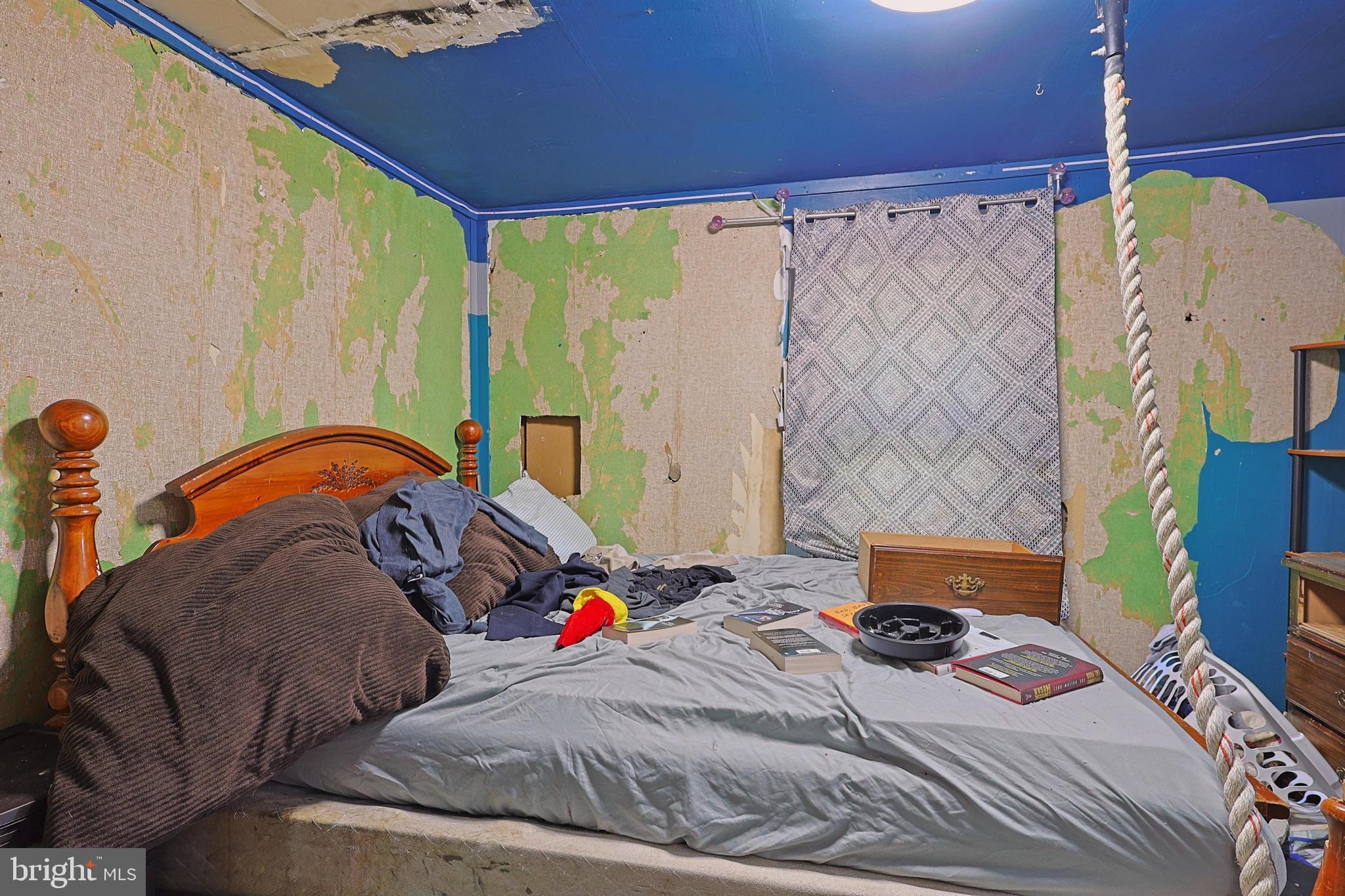 6307 Pious Ridge Road Berkeley Springs, WV 25411 - Photo 7 of 25 Room in need of renovation and care.