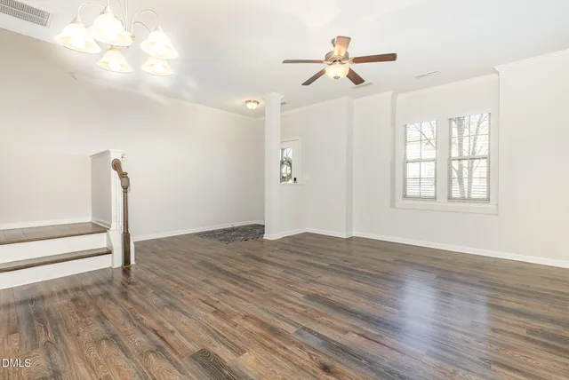 a kitchen with granite countertop kitchen island stainless steel appliances a refrigerator stove top oven and sink