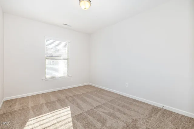 a bathroom with a granite countertop sink mirror and toilet