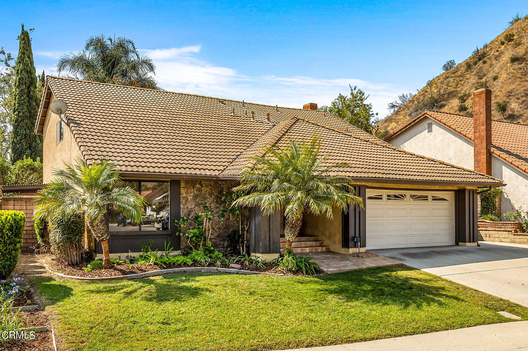 1006 Amber Drive Santa Paula, CA 93060 - Photo 2 of 37 a view of a white house with swimming pool in front of it