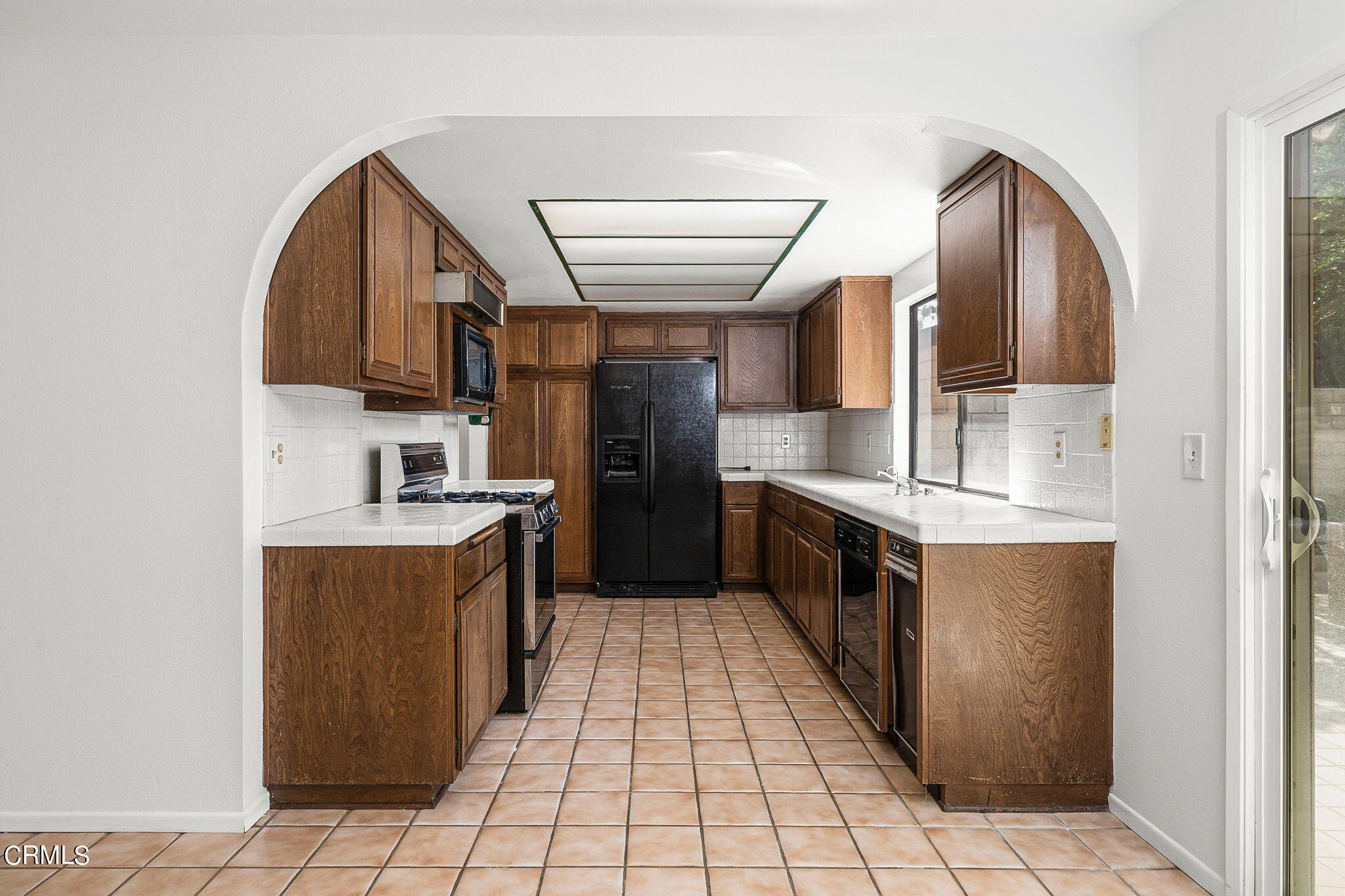 1006 Amber Drive Santa Paula, CA 93060 - Photo 13 of 37 a large kitchen with stainless steel appliances granite countertop a stove a sink and a refrigerator