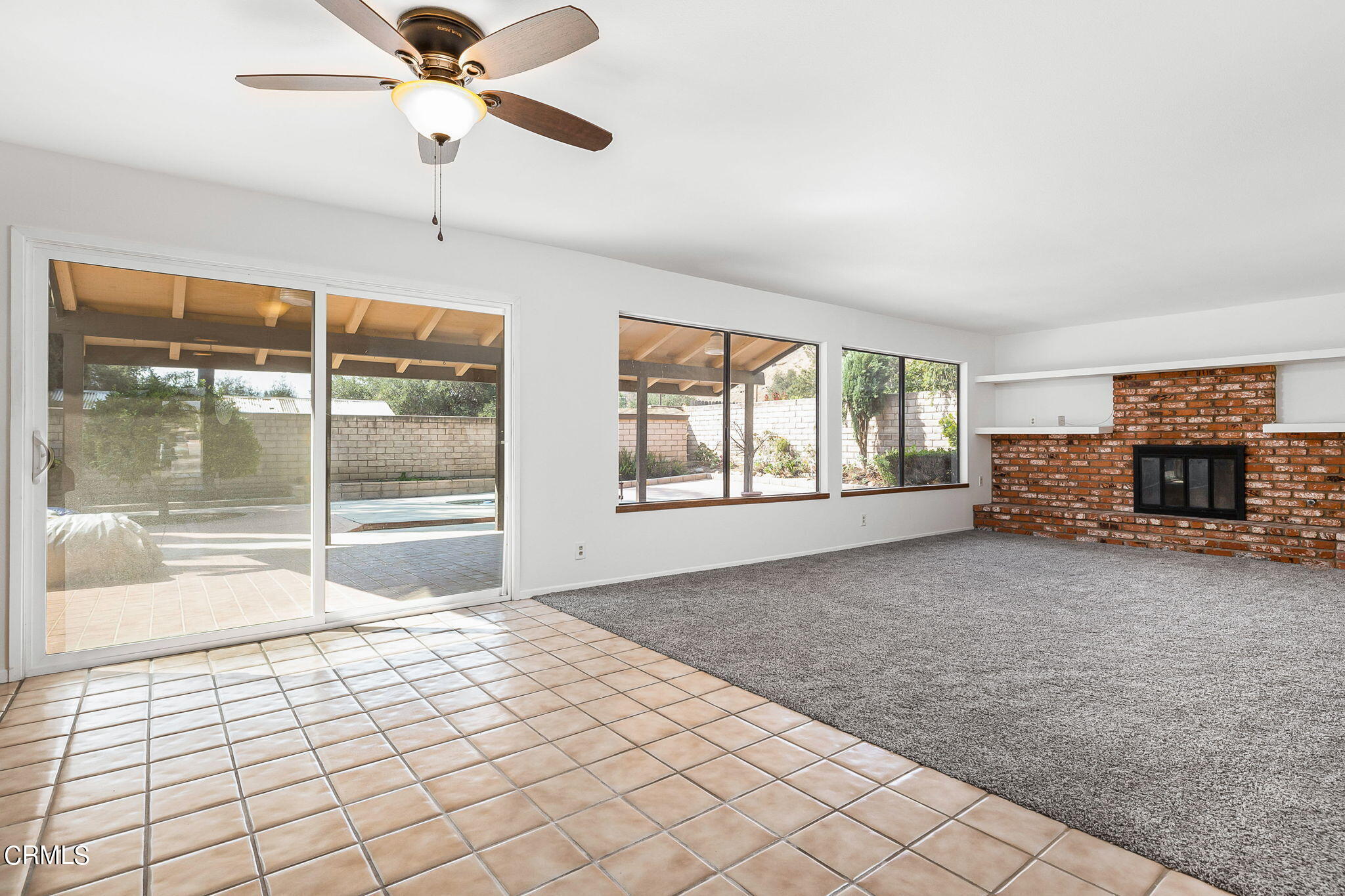 1006 Amber Drive Santa Paula, CA 93060 - Photo 10 of 37 a view of an empty room with a fireplace and a window