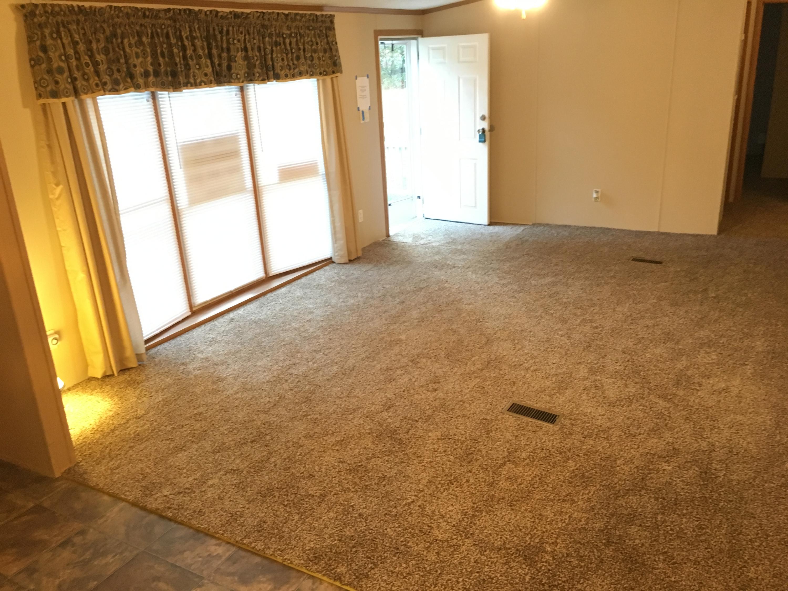 232 Gaston McLean Road Rockingham, NC 28379 - Photo 3 of 8 Living Room with New Carpet and Paint.
