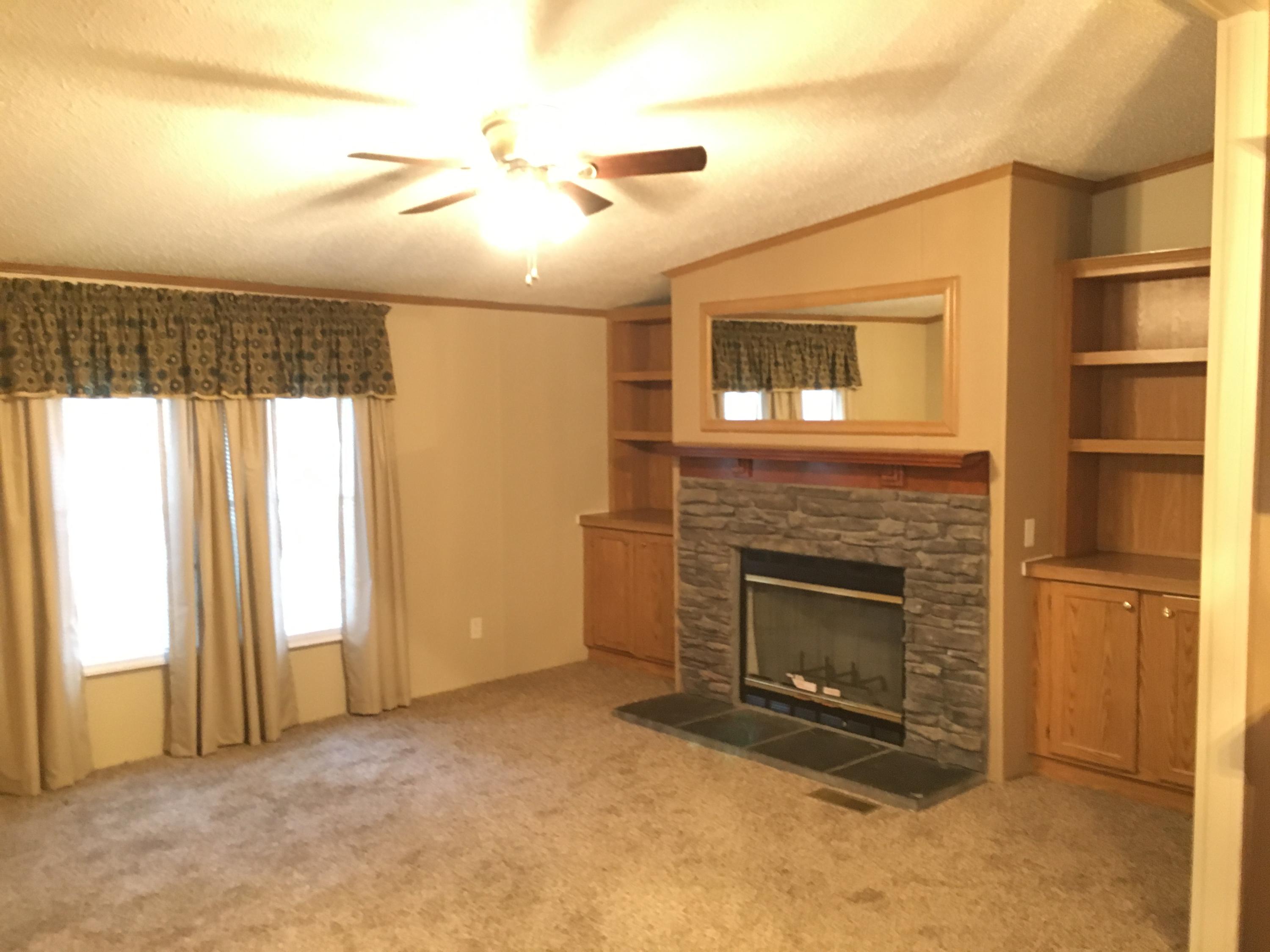 232 Gaston McLean Road Rockingham, NC 28379 - Photo 5 of 8 Den with Fireplace and Bookcases!