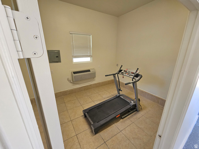 812 East Bates Cyn Road Tooele, UT 84074 - Photo 90 of 144 Versatile room featuring tile flooring, neutral wall tones, a window with blinds, and a wall-mounted air conditioning unit