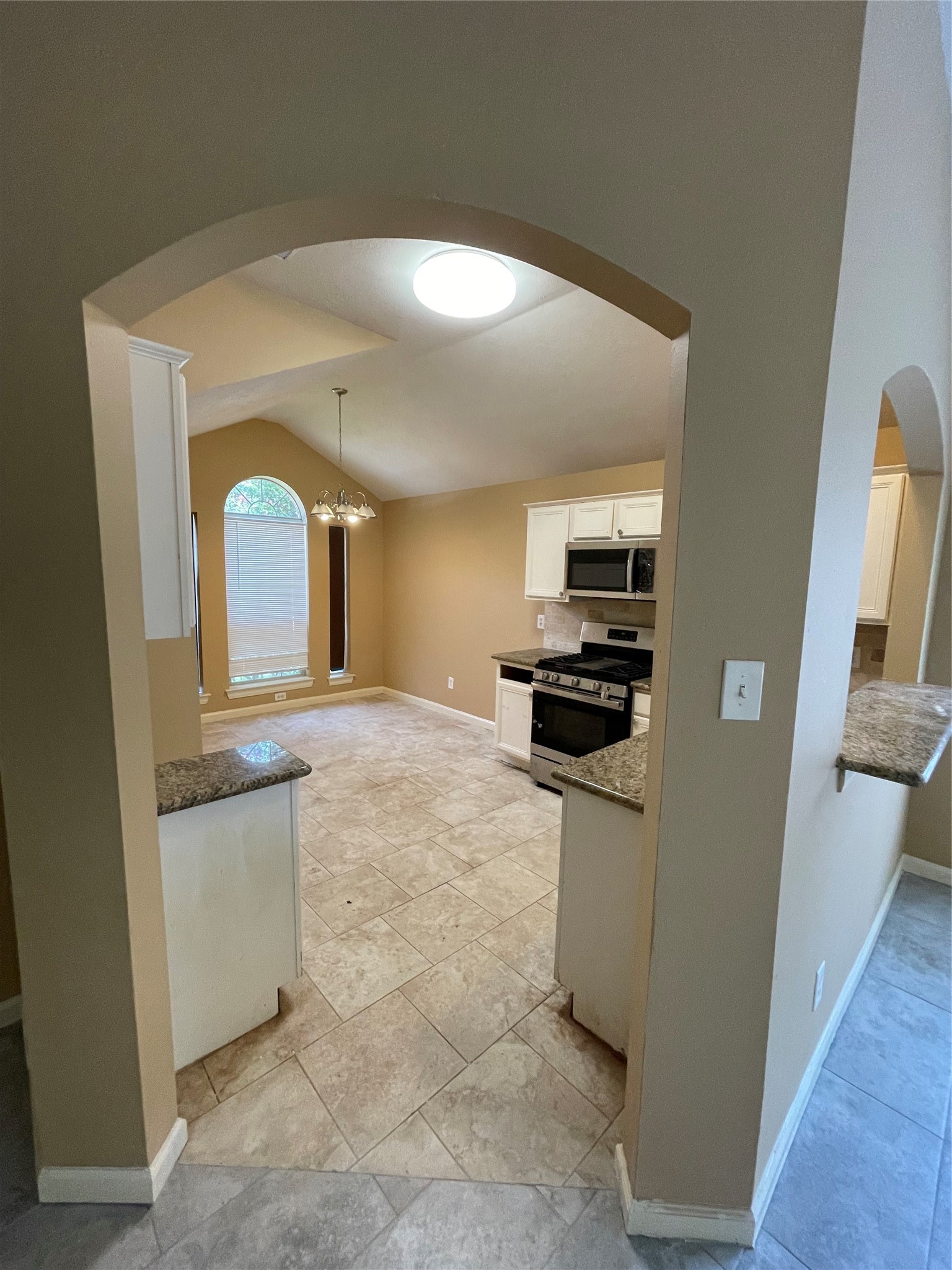5235 Sherilynn Drive Spring, TX 77373 - Photo 5 of 11 a kitchen with stainless steel appliances a refrigerator and a stove top oven