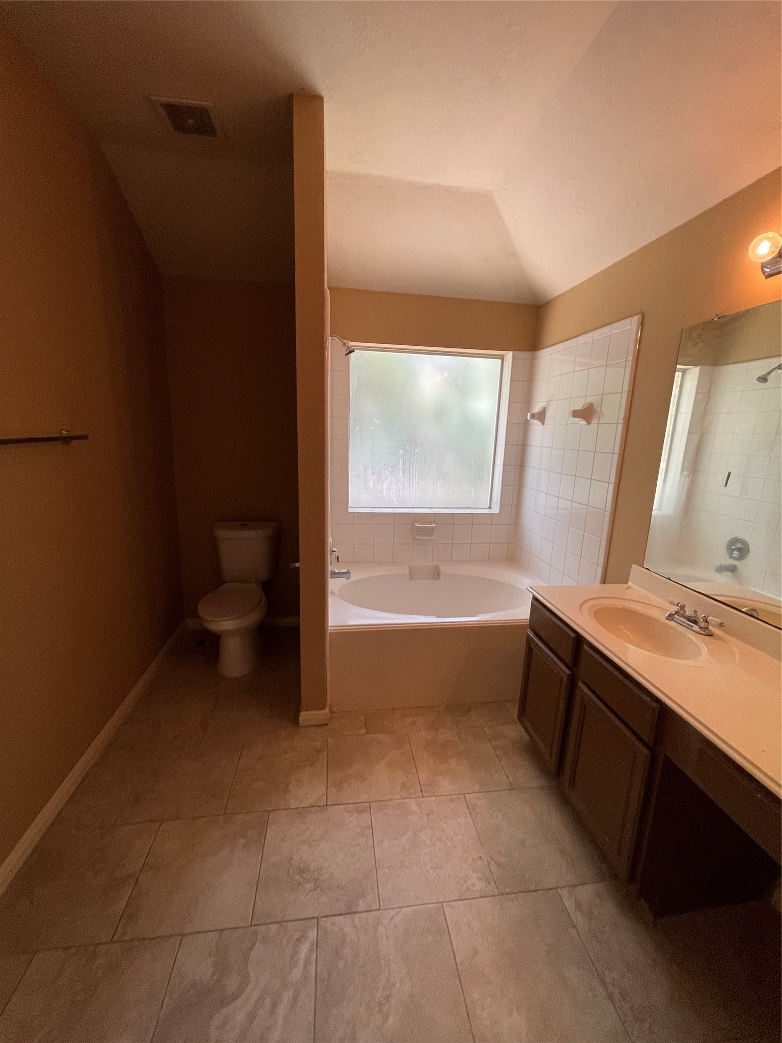 5235 Sherilynn Drive Spring, TX 77373 - Photo 10 of 11 a bathroom with a sink a toilet and tub