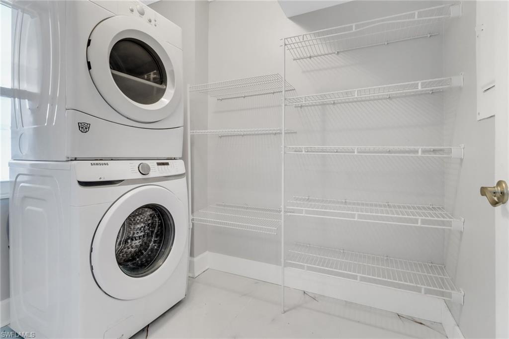 15 Watercolor Way, Unit 15 Naples, FL 34113 - Photo 12 of 29 a utility room with dryer and washer