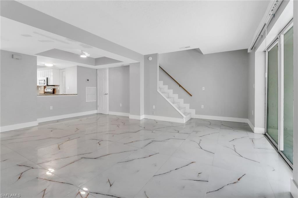 15 Watercolor Way, Unit 15 Naples, FL 34113 - Photo 13 of 29 an empty space with white walls and stairs
